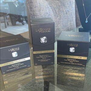 La Roughe bundle of 3 of neck and décolleté serum mask and cream over $1500
